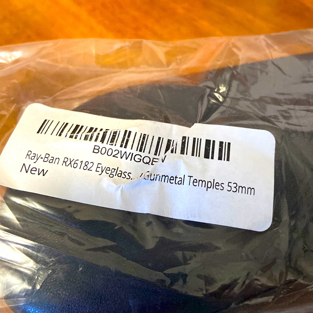 Ray-Ban reading glasses - never used; get your lenses inserted. Gun metal color